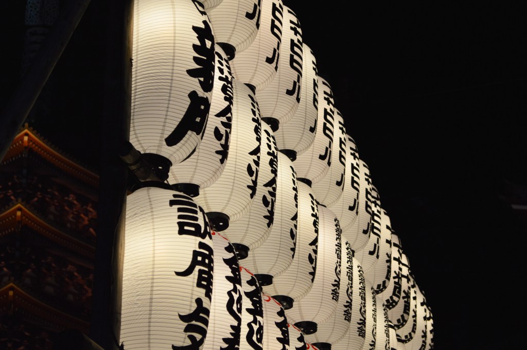 Traditional Japanese paper lanterns with kanji characters at a festival or shrine, Japan