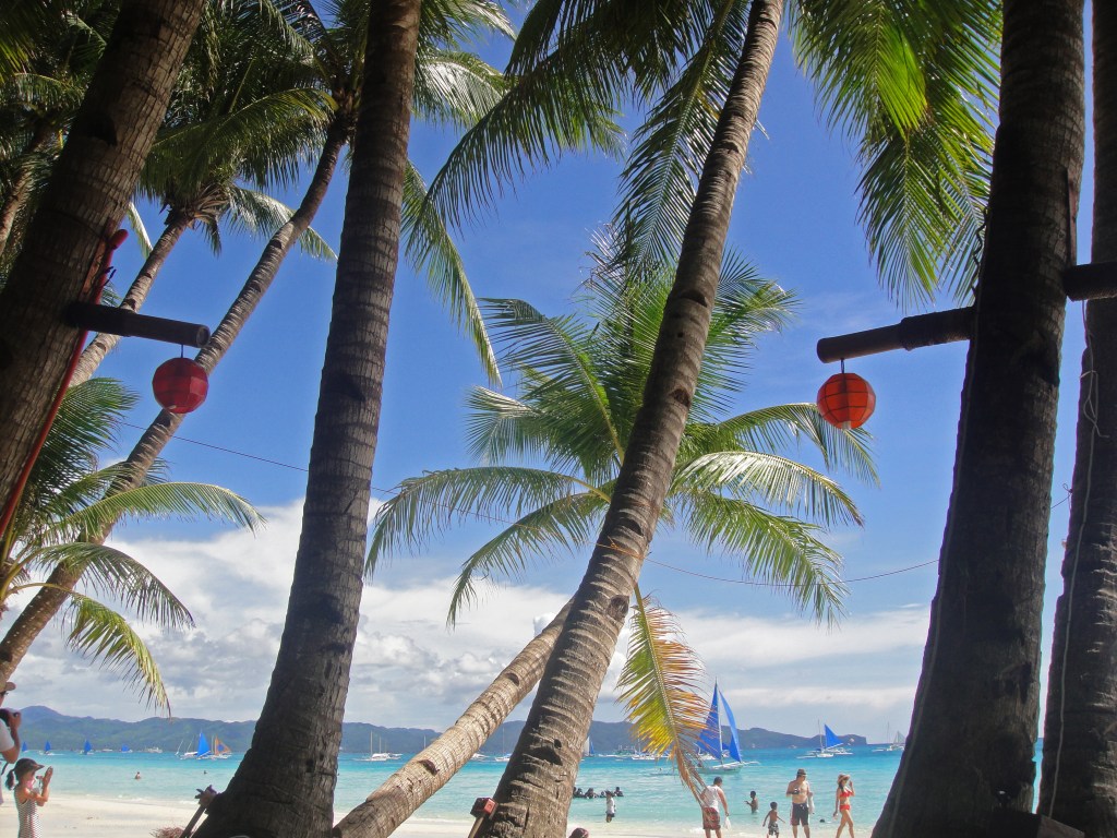 Boracay White Beach, Philippines – Tropical paradise with palm trees and crystal-clear water