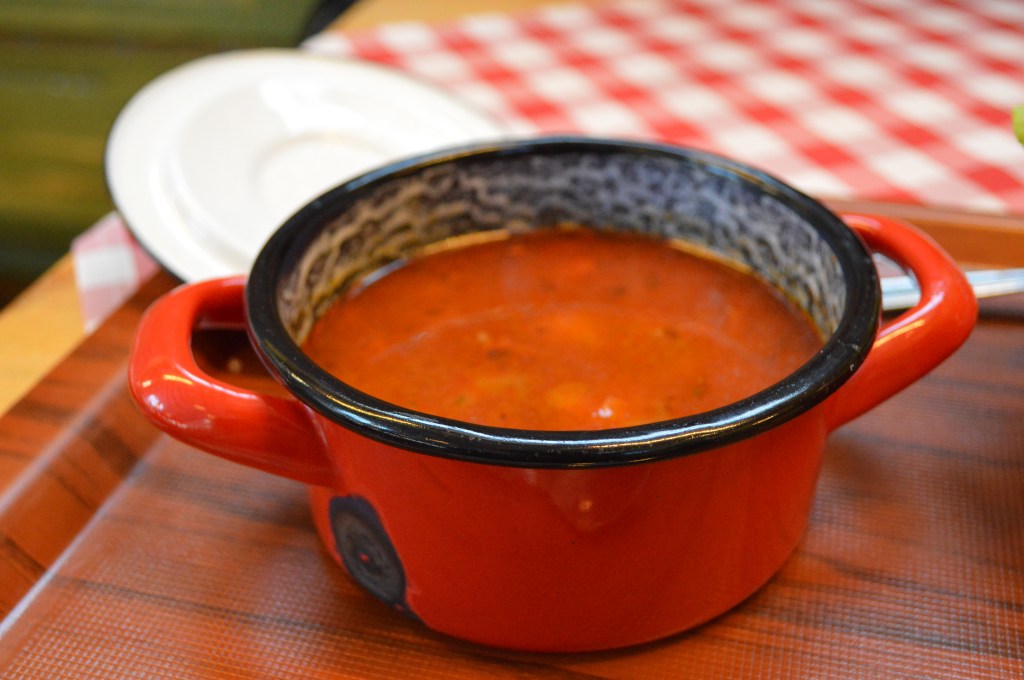 Tomato Soup – A rich and hearty European-style comfort food Classic European tomato soup in a rustic red pot – Warm and comforting dish