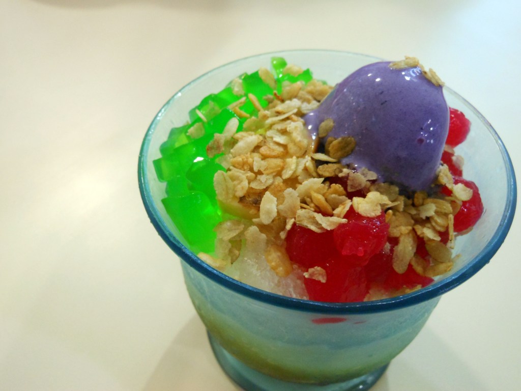 Filipino Halo-Halo dessert with shaved ice, sweet beans, jelly, and purple yam – A refreshing tropical treat