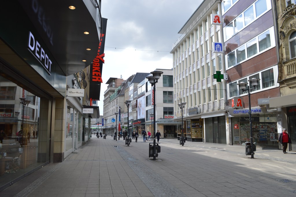 Pedestrian shopping street in Essen – Urban scene with stores and people