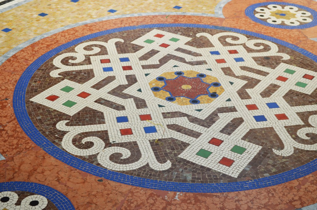 Colorful mosaic floor with intricate geometric design in Milan