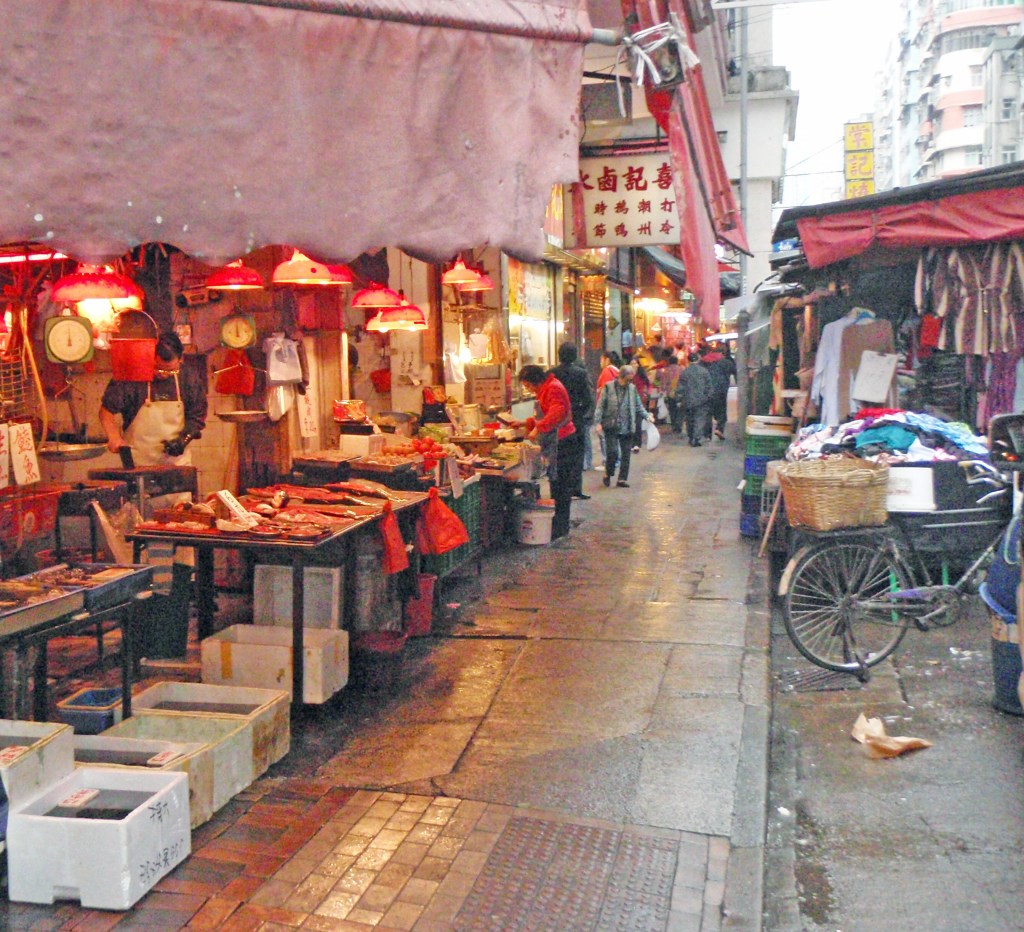 Bustling Hong Kong street market with food stalls and traditional Chinese shops – Vibrant city life