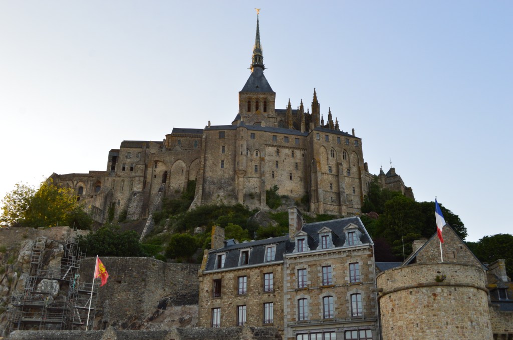Mont Saint-Michel Abbey during daylight – Iconic medieval abbey rising above stone houses