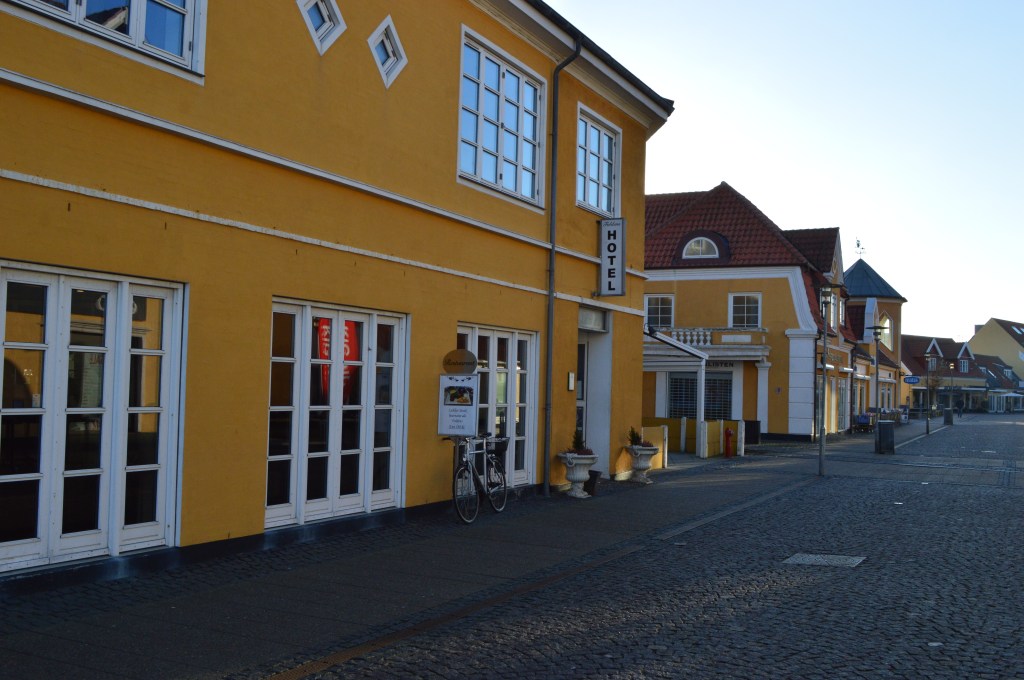 Traditional yellow house and bicycle in Skagen, Denmark