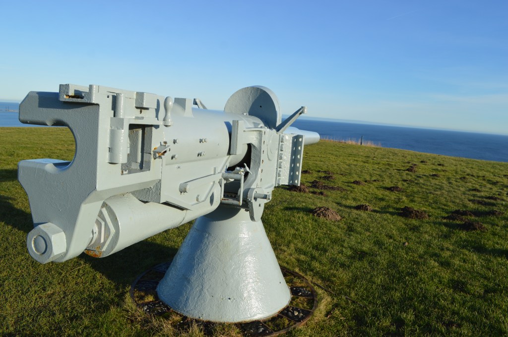 Old coastal cannon facing the sea in Frederikshavn, Denmark Historic coastal artillery gun on a hill in Frederikshavn
