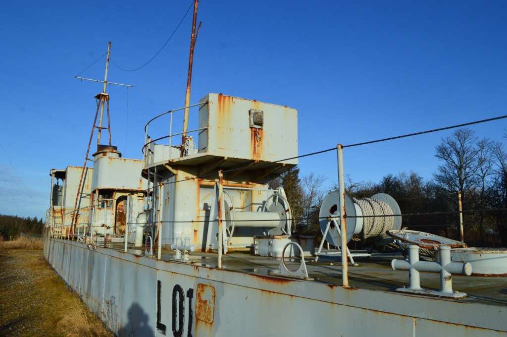 Decommissioned warship displayed at the Bangsbo Fort in Frederikshavn Rusty naval equipment and radar system on a military ship