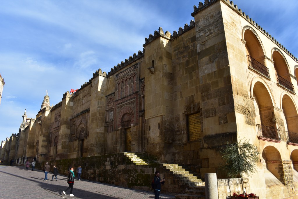 outer walls and gate of the mezquita in córdoba – intricate moorish architecture