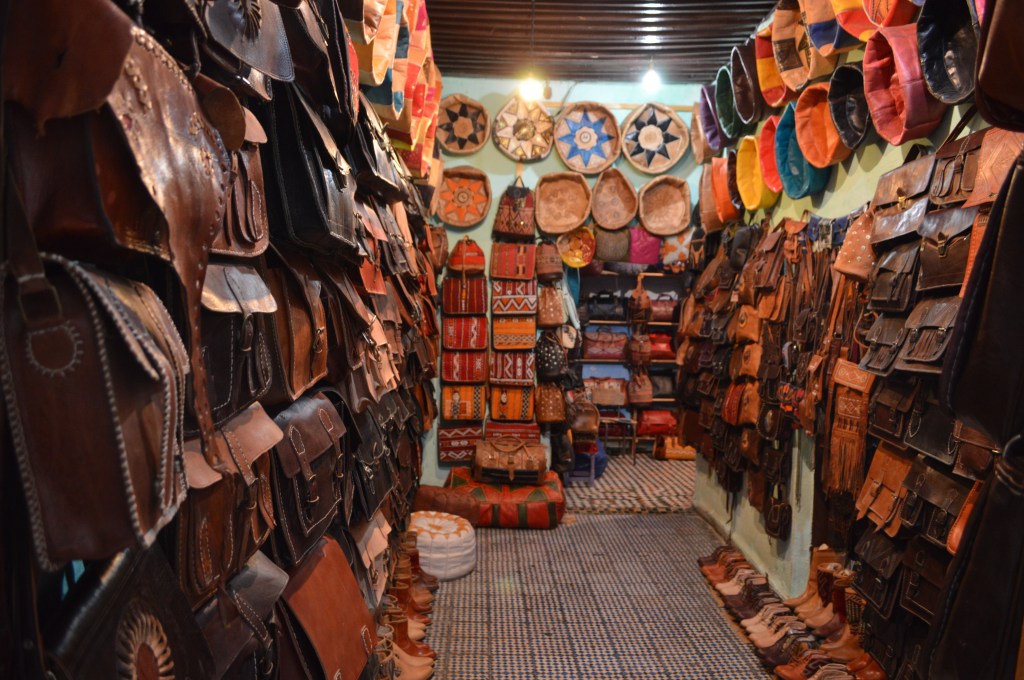 Traditional Moroccan market (souk) selling handmade crafts and leather goods