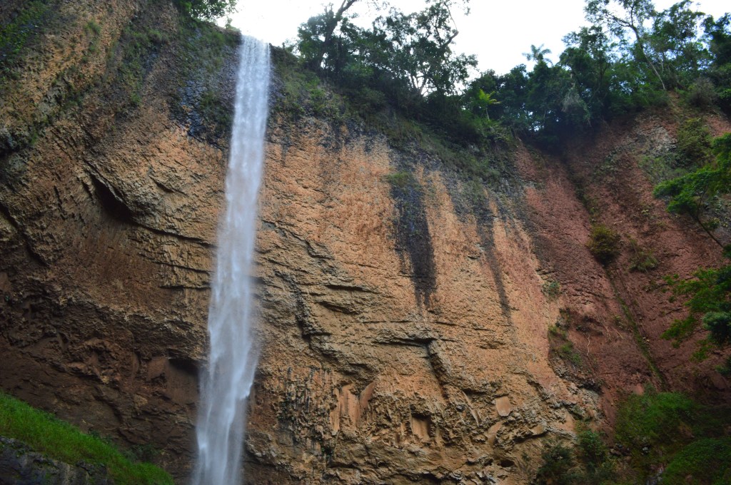 Tall waterfall cascading down a cliff in São Pedro, Brazil – nature travel stock photo
