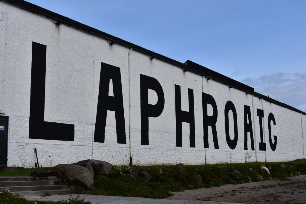 Laphroaig distillery building with large painted sign in Islay, Scotland – Islay stock photos