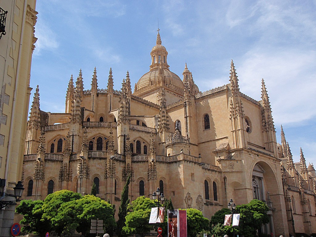 segovia cathedral in spain – gothic architecture with towers and domes against blue sky