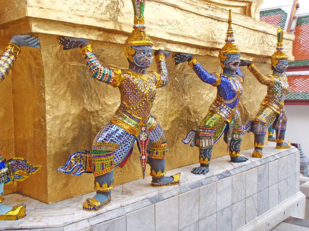 Colorful Yaksha guardian statues at Wat Phra Kaew, Bangkok, Thailand – Traditional Thai temple decorations