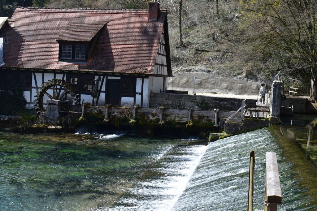 Traditional house beside the crystal-clear spring water of Blaubeuren, Germany - Blaubeuren stock photos