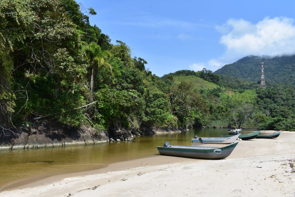 Canoes on a quiet river beach in Ubatuba, Brazil - Ubatuba stock photos