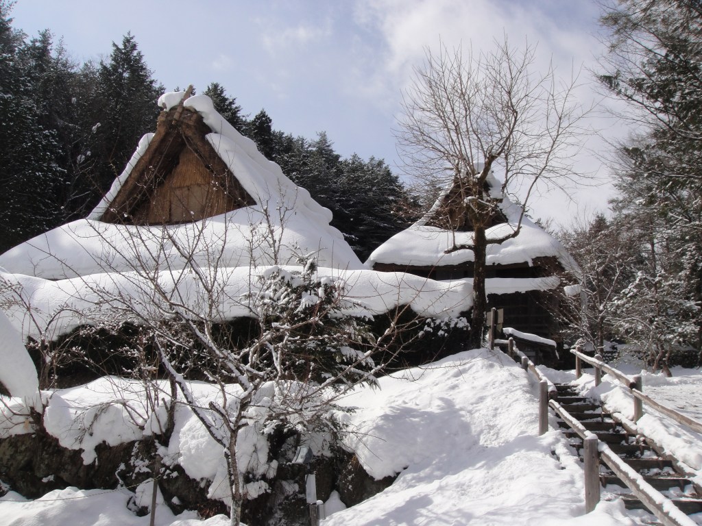 Traditional gassho-zukuri house covered in heavy snow in Hida Takayama, Japan - Hida-Takayama stock photos