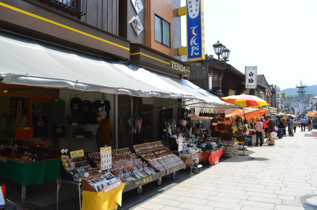 Vibrant street scene at Wajima Morning Market in Ishikawa, Japan, with souvenir stalls and visitors - Wajima stock photos