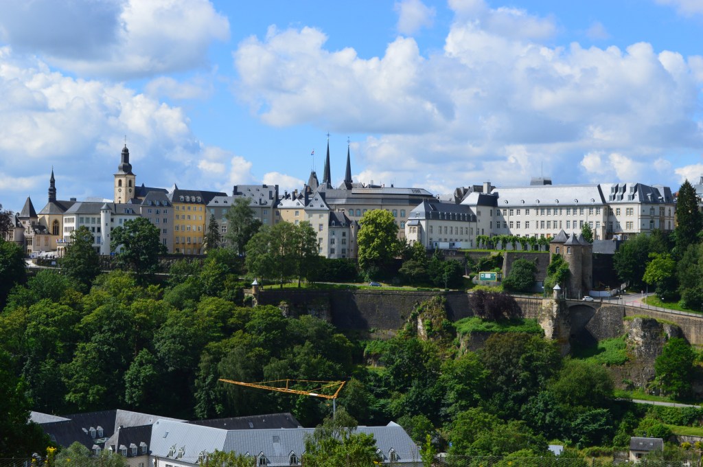 Luxembourg cityscape with historical fortress walls and skyline under a bright blue sky - Luxembourg stock photos